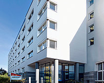 Das Bild zeigt das Kappel-Gebäude in der Universitätstraße 74, in dem sich auch das Wohnungslosenteam des Jobcenter befindet.